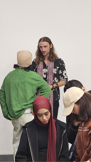 BUE students reviewing Melbrins' sketchbooks